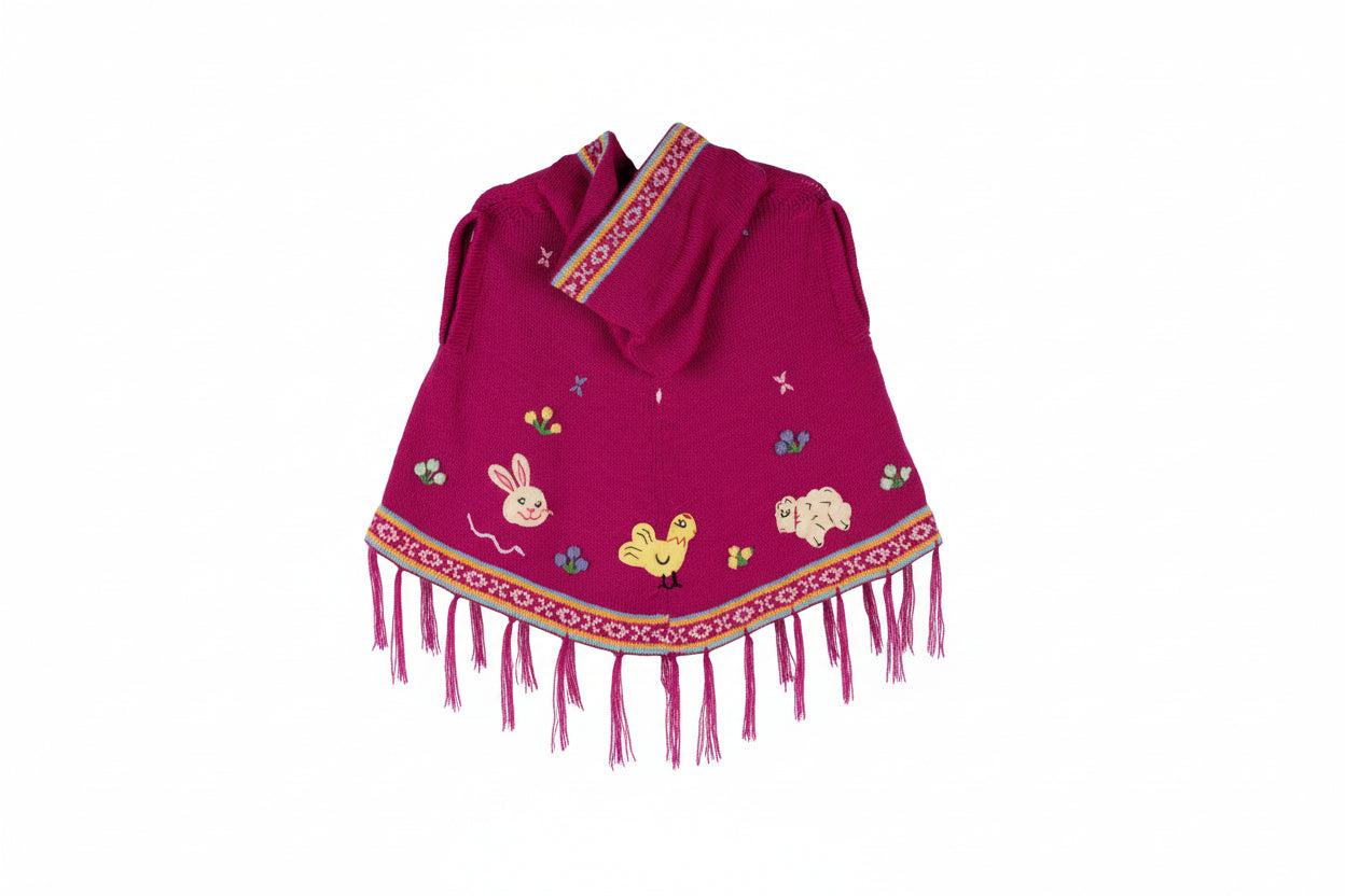 Pink children's poncho with animal designs and colorful trim on a white background