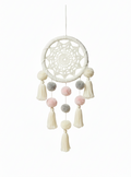 Decorative dreamcatcher with ligth pink and grey pom-poms and tassels 